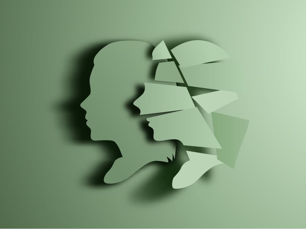 Green silhouettes of male and female heads: self-talk